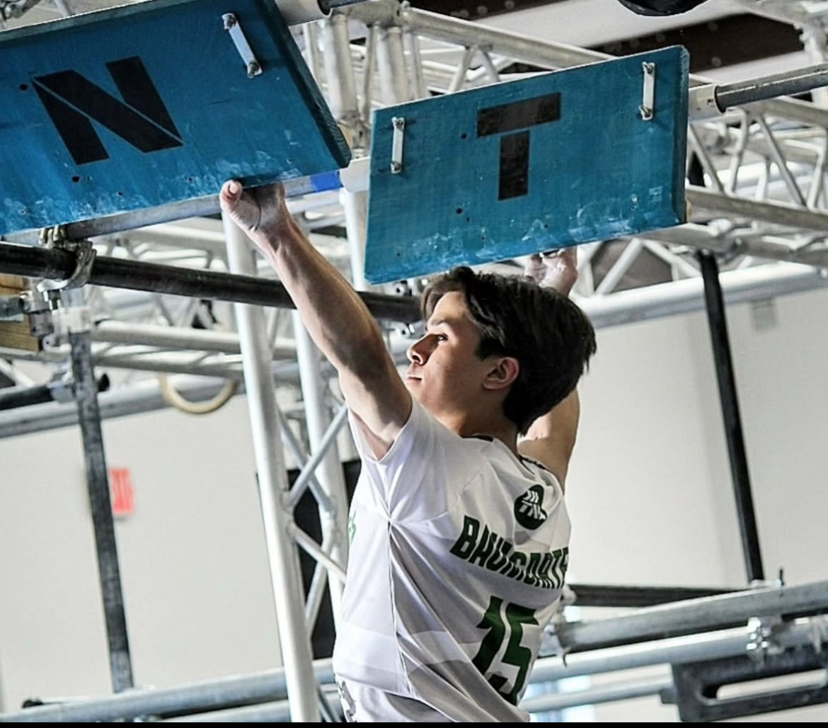 Jeff Baumgarten (10) traverses through an obstacle. 