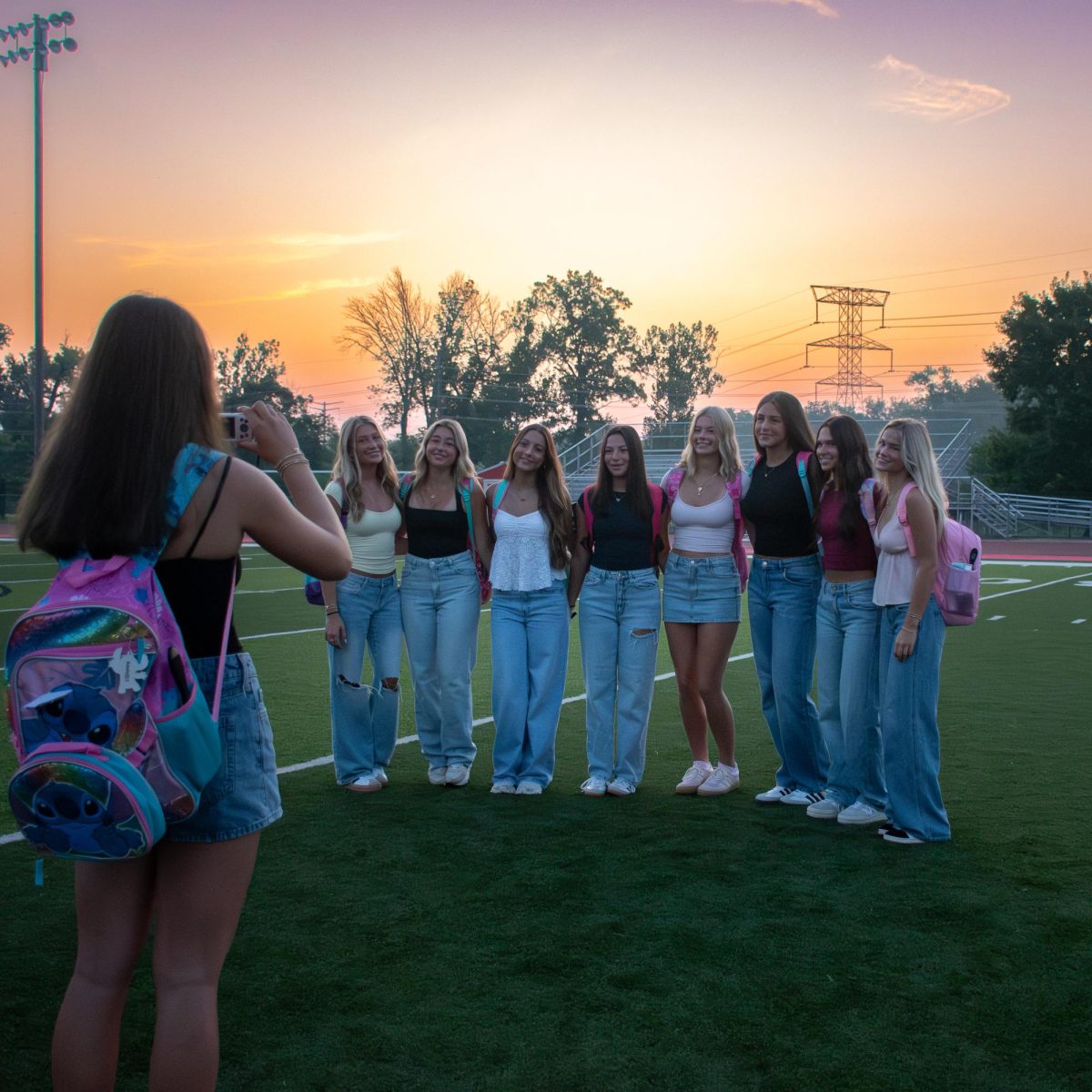 Sophia Fischer captures a group of senior girls watching the sunrise at the Class of 2025’s senior sunrise on Aug. 18. Photo By Caroline Greene 
