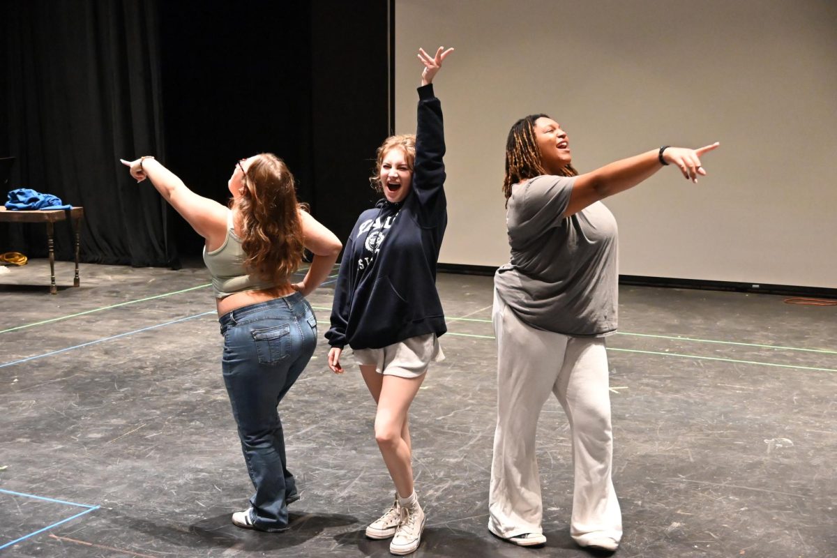 Rosie, played by Norah Gatesh (11) , Donna, played by Clover Fortus (12) and Tanya played by Kiera Anderson-Pittman (12) rehearse lines for "Mamma Mia" in the theater on Sept. 23. 
