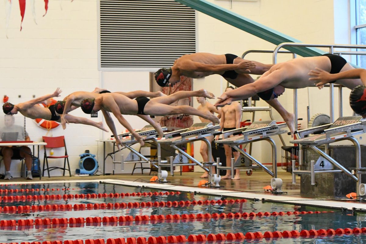 On Sept. 18, Charlie Sicking (11) dives head first into a race at Kirkwood High School. Sicking placed 5th with a time of 2:17.15.