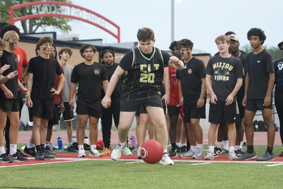 Student Section Leader Matthew Solomon leads the senior class to victory at the class kickball games on Sept. 15