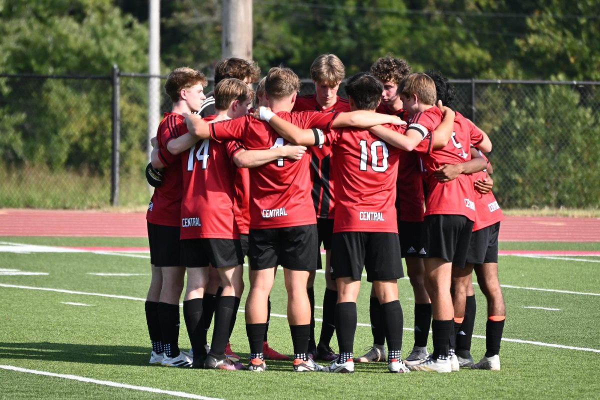 Varsity soccer team huddles at the beginning of the game against Lafayette on Sept. 10. The Colts beat the Lancers 4-2.