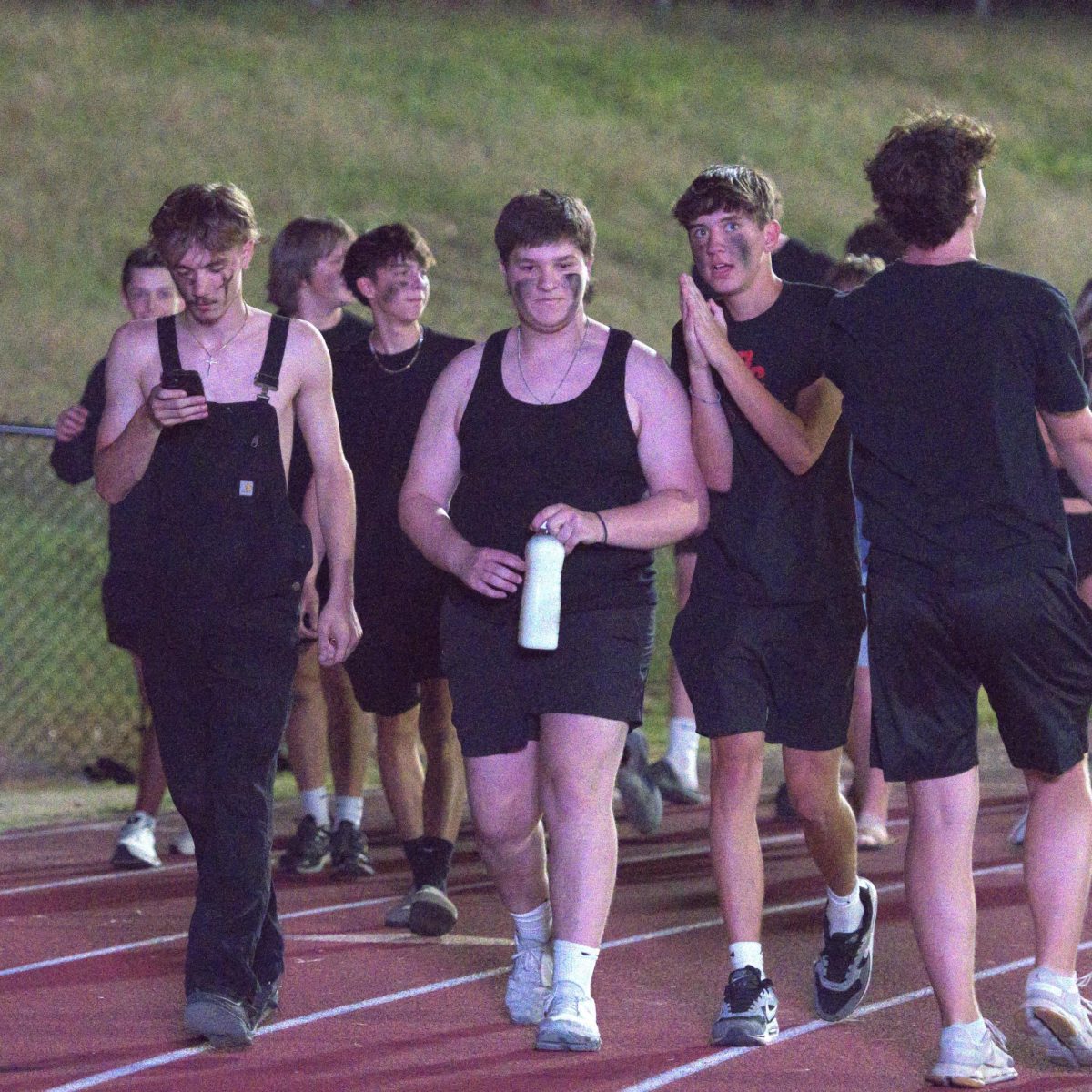 Matthew Solomon walks towards the Parkway North student section, ready to participate in a tradition called the “milk jug challenge.” Solomon states “I felt like I was cheated this year as, Parkway North's Aaron Gibson decided to pour milk all over his face instead of actually chugging it.” This tradition has been passed down from seniors to seniors.