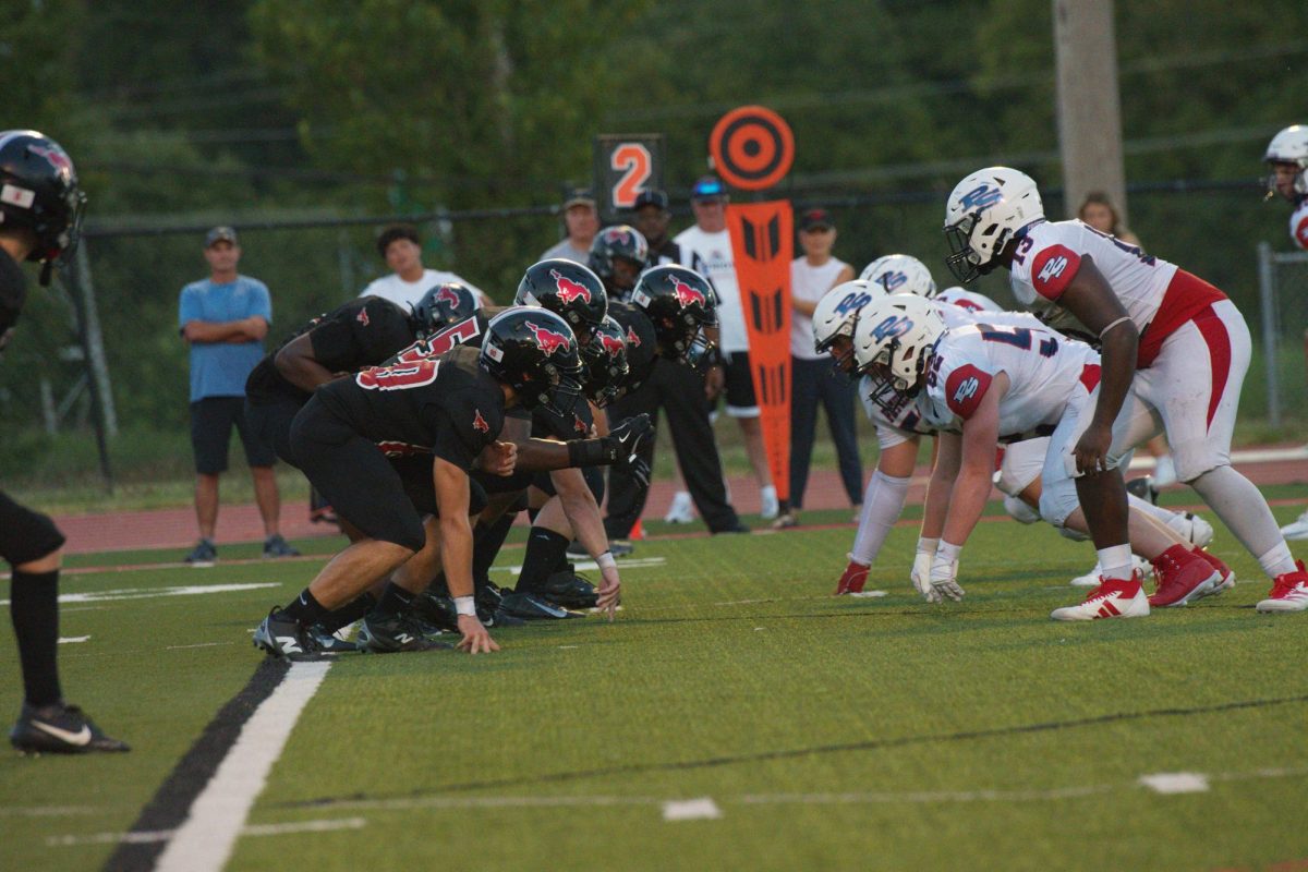 Jack Cabral (11) and Israel Anjorin (12) prepare for the ball to snap in a game against Parkway South on Aug. 29. Anjorin, who plays both offensive and defensive line, had one defensive tackle in the 6-0 victory over the Patriots. 