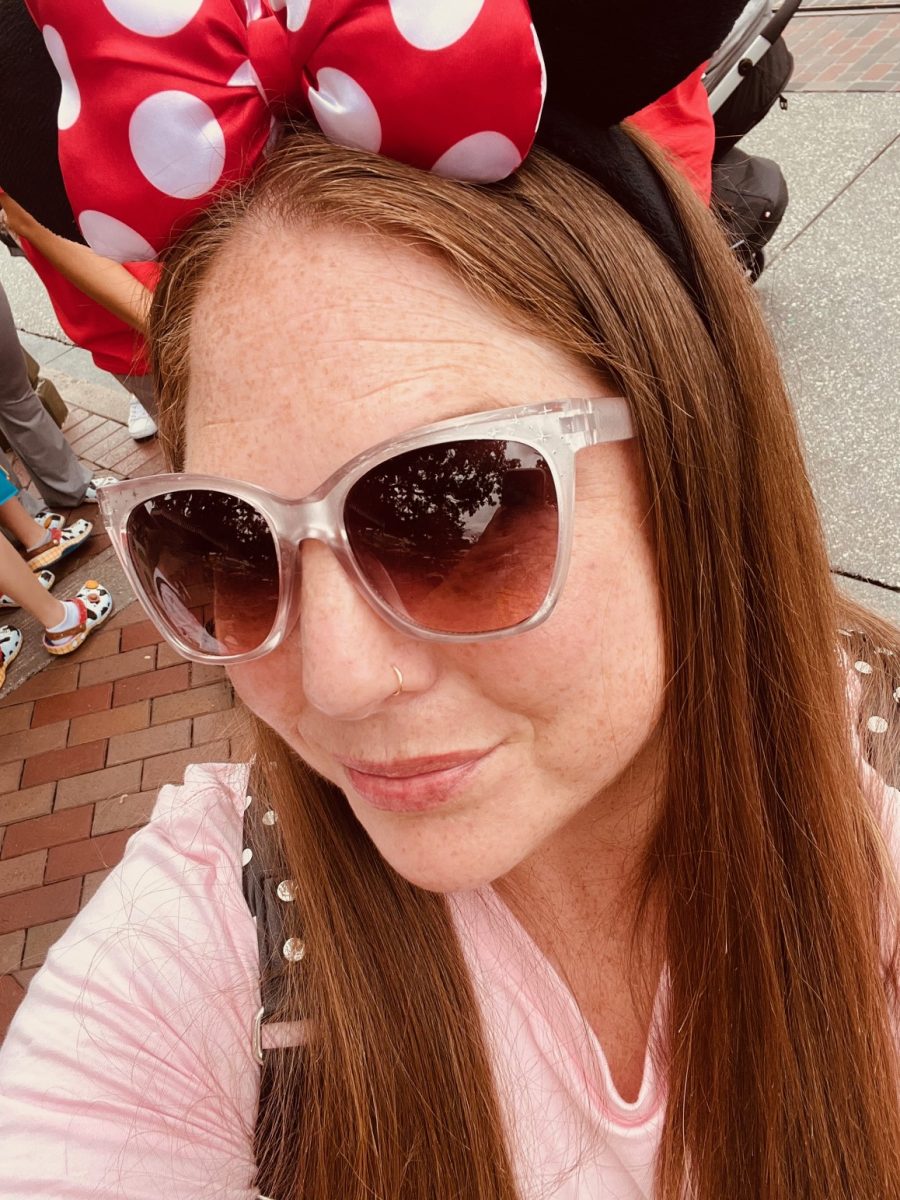 Christine Schmitt poses for picture in Disneyland. Schmitt describes Disney as "one of my favorite past times". Photo courtesy of Christine Schmitt