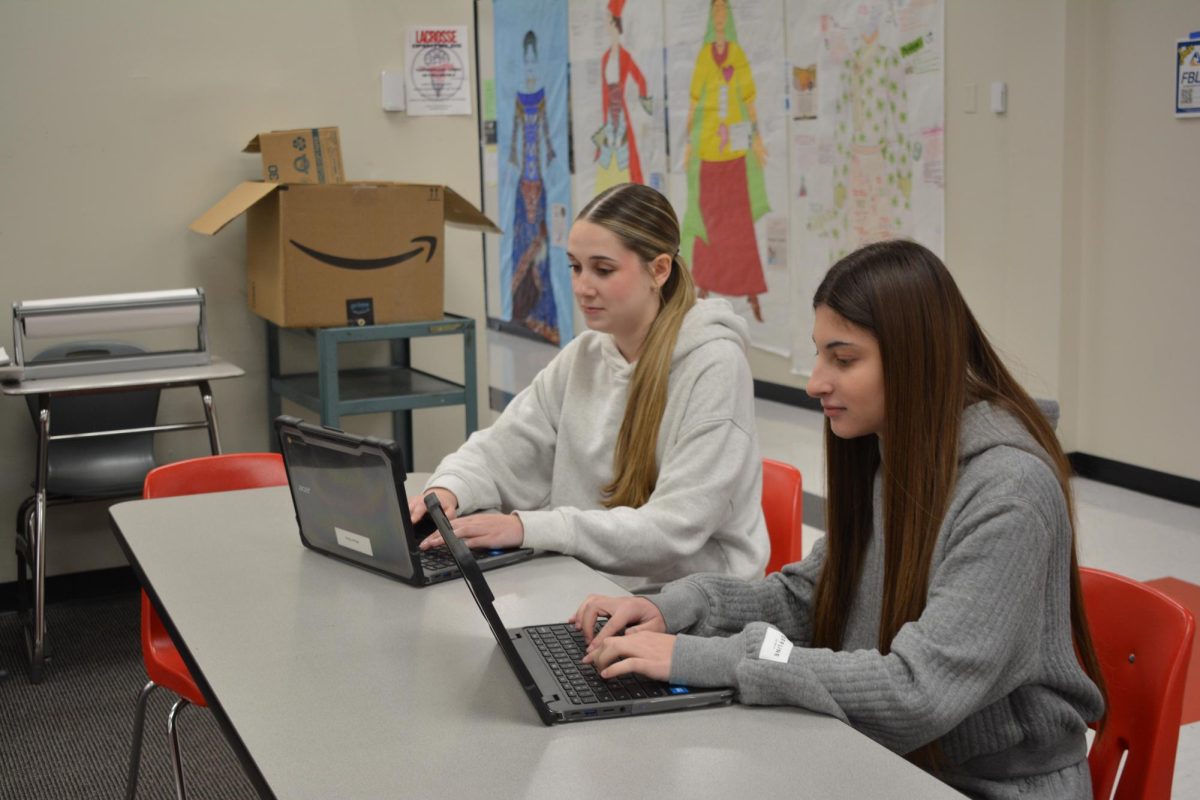 Raina Wilson (12) and Bella Margul (12) studying for their AP Statistics final. 