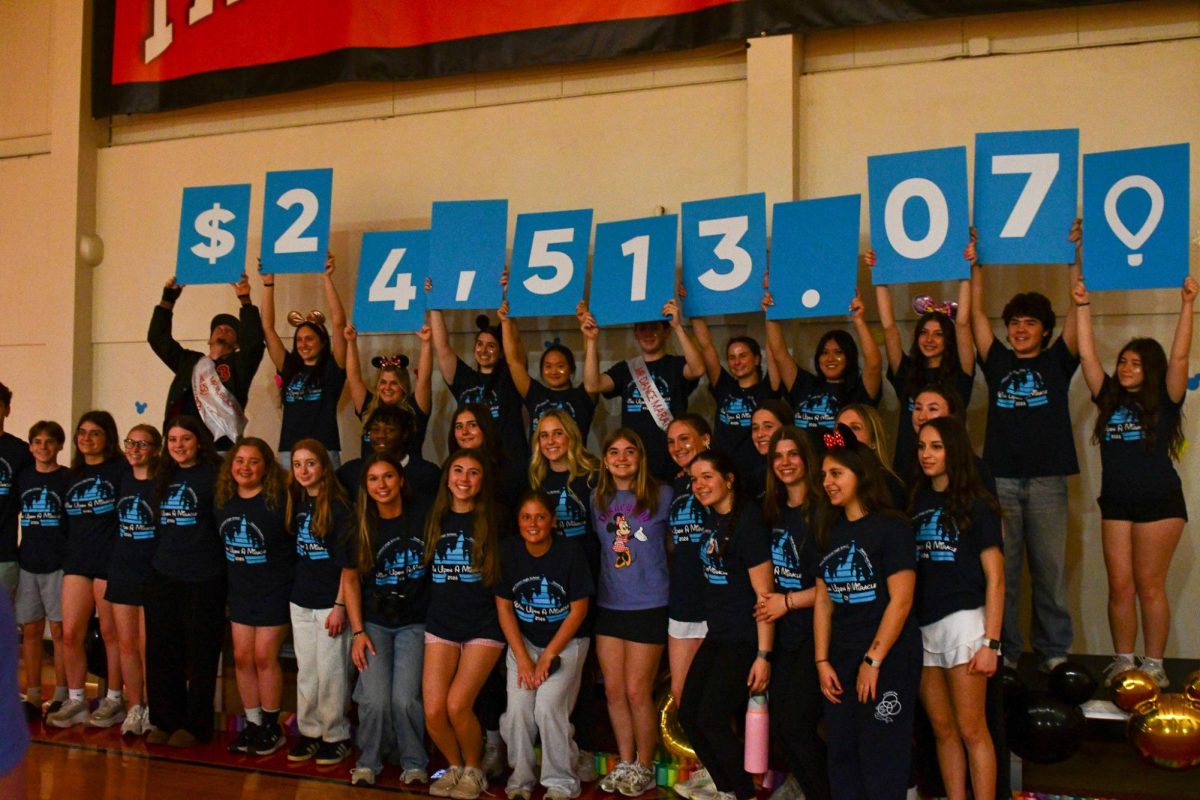 The Dance Marathon committee gather together for a group picture at the end of the event on March 7.