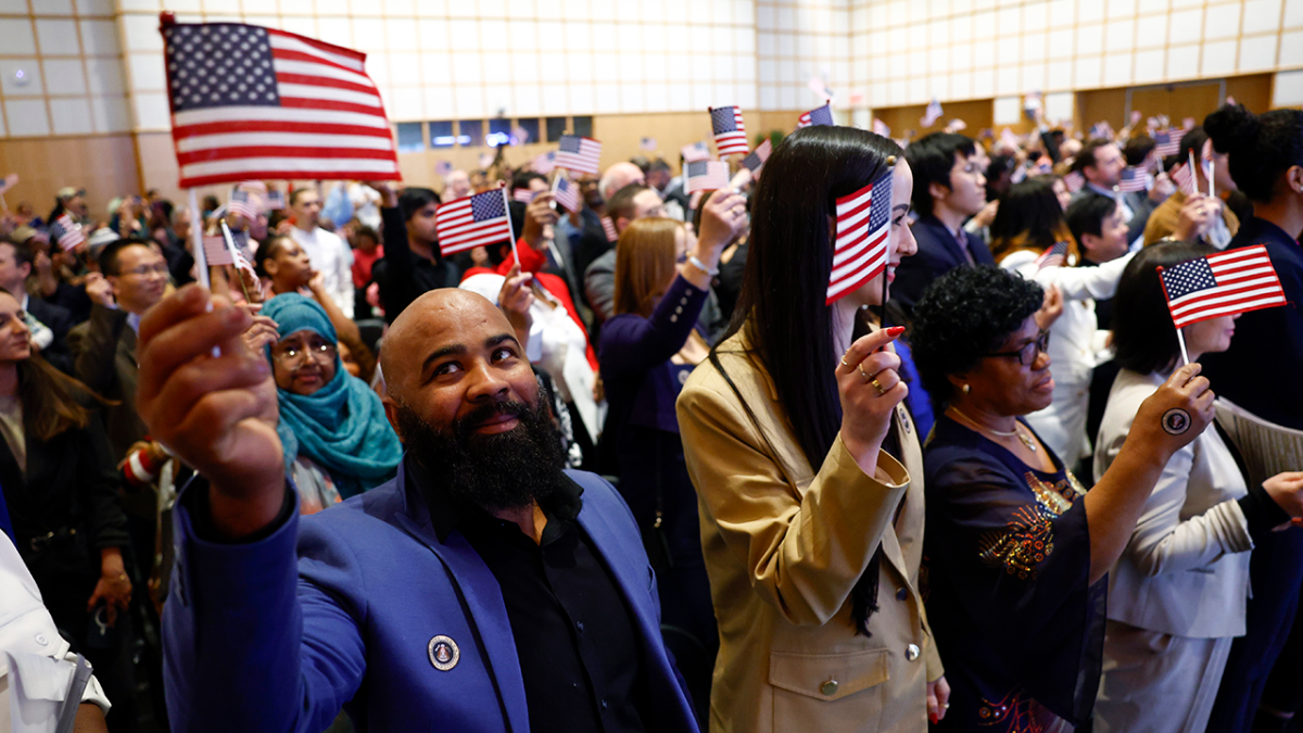 Newly naturalized citizens celebrate after being sworn into the United States. This process can take on average 5-10 years. 